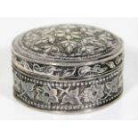 A small silver patch box with embossed organic rel