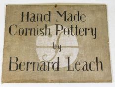 A 1950/60's canvas on board Bernard Leach pottery advertising sign for a shop 12in x 9in. Provenance