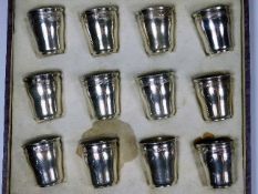 A boxed set of French silver shot cups approx. 120