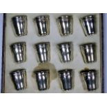 A boxed set of French silver shot cups approx. 120