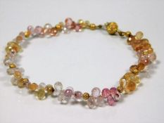 An imperial topaz bracelet with 18ct gold clasps 9