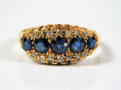 An 18ct gold ring set with sapphire & diamonds 4.4