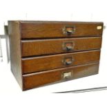 A small set of oak stationery drawers