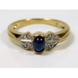 A 9ct gold ring set with cabochon sapphire & diamo