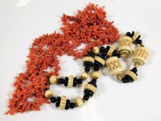 An antique coral necklace twinned with a necklace