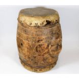 An antique African tribal art drum with two carved