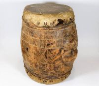 An antique African tribal art drum with two carved