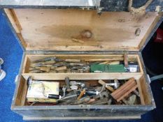 A carpentry box of mixed tools including planes