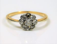 A Victorian 18ct gold diamond daisy ring, approx.