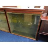 An antique glass display cabinet from Looe's Dowli