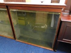 An antique glass display cabinet from Looe's Dowli