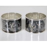 A pair of heavy gauge engraved silver niello style