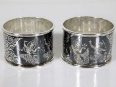 A pair of heavy gauge engraved silver niello style
