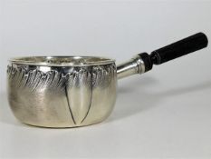 A decorative French silver brandy saucepan with ro