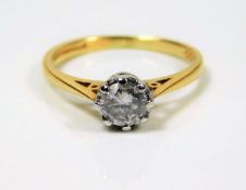 An 18ct gold diamond solitaire ring set with 0.6ct
