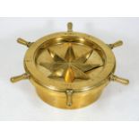 An articulated brass cigar ashtray in form of a brass ships compass 9in