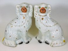 A pair of 19thC. Staffordshire pottery spaniel dogs 10in