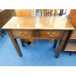 A small oak hall table with brass handles