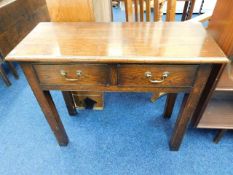 A small oak hall table with brass handles