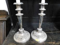 A pair of silver plated candle holders