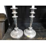 A pair of silver plated candle holders