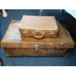 A leather suitcase & two others