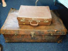 A leather suitcase & two others