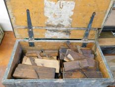 A boxed quantity of wooden moulding planes