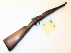 An 1895 bolt action Mauser rifle made by Loewe Ber