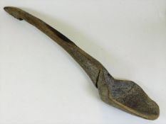 A 19thC. carved gruel spoon, 24in