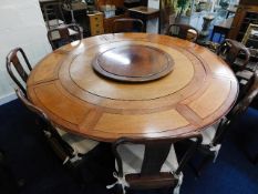 A large metamorphic Chinese rosewood table with ei
