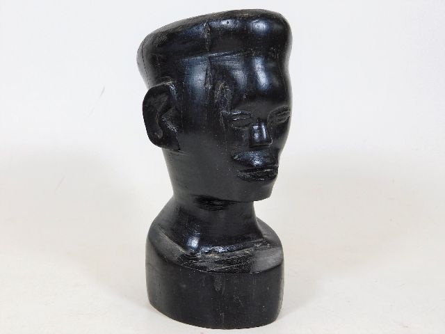 A 19thC. carved African hardwood bust approx. 5in