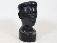 A 19thC. carved African hardwood bust approx. 5in