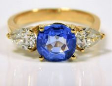 A fine 18ct gold ring set with unheated natural Ceylon sapphire of approx. 2.6cts & two pear shaped