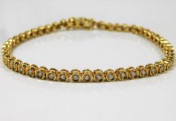 An 18ct gold line bracelet set with 2ct diamonds 1