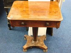 A Victorian pedestal table with drawer