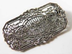 A silver designer brooch, indistinctly signed to r