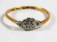 An 18ct gold ring set with platinum mounted diamon