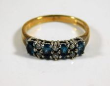 A 9ct gold ring set with blue & white stones 2.4g