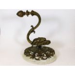 A gilt bronze wall sconce with horned animal decor