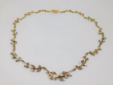An 18ct gold & diamond necklace of organic form, a