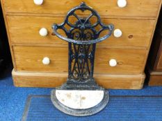 A Victorian cast iron stick stand with tray