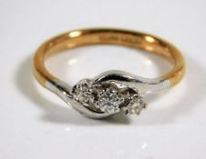 An antique 18ct gold ring set with three diamonds