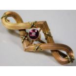 A 9ct gold brooch set with pink tourmaline 2.5g