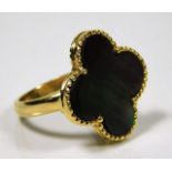 An 18ct gold "lucky clover" ring set with mother o