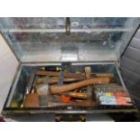 A steel box of tools including a box of routers