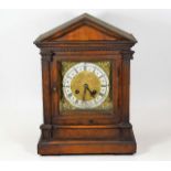 A brass & silvered dial oak mantle clock
