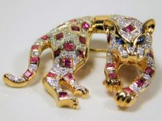 An 18ct gold Cartier style panthere brooch set wit