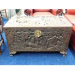 A large early 20thC. carved camphor wood chest