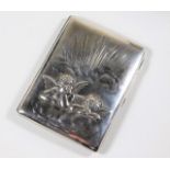 A silver cigarette box with relief cherub decor